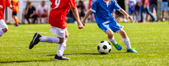 children playing soccer
