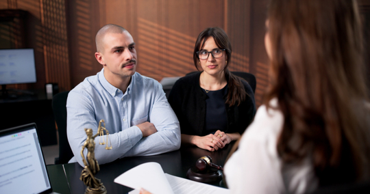 couple consulting with an attorney