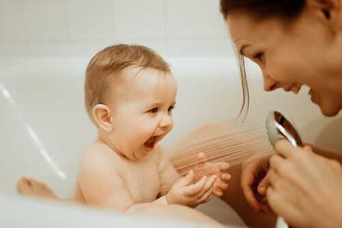 A mother giving her baby a bath